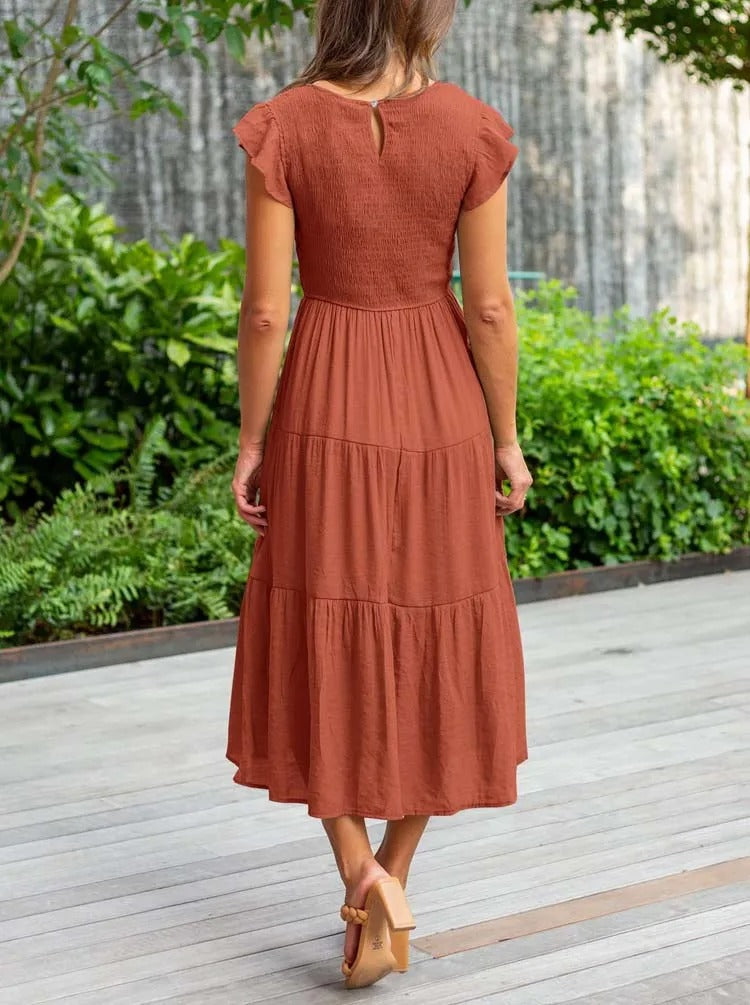 Luchtig ontwerp met ruches en praktische zakken Elegante zomerjurk - Seaton