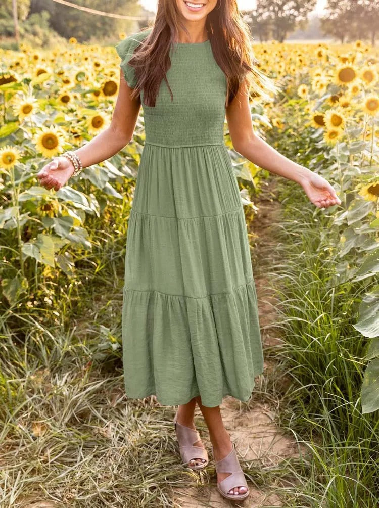 Luchtig ontwerp met ruches en praktische zakken Elegante zomerjurk - Seaton