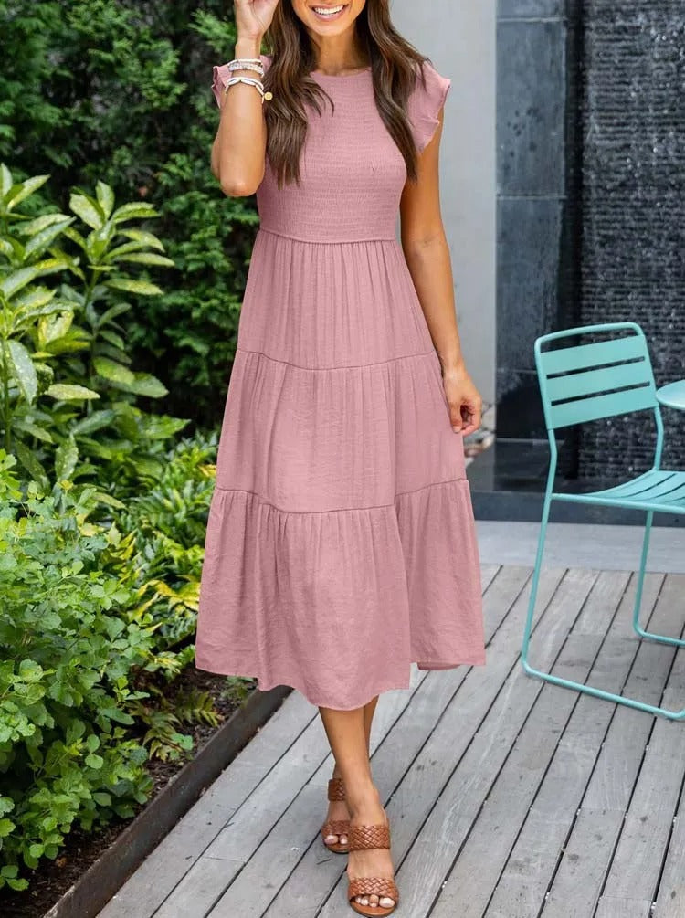 Luchtig ontwerp met ruches en praktische zakken Elegante zomerjurk - Seaton