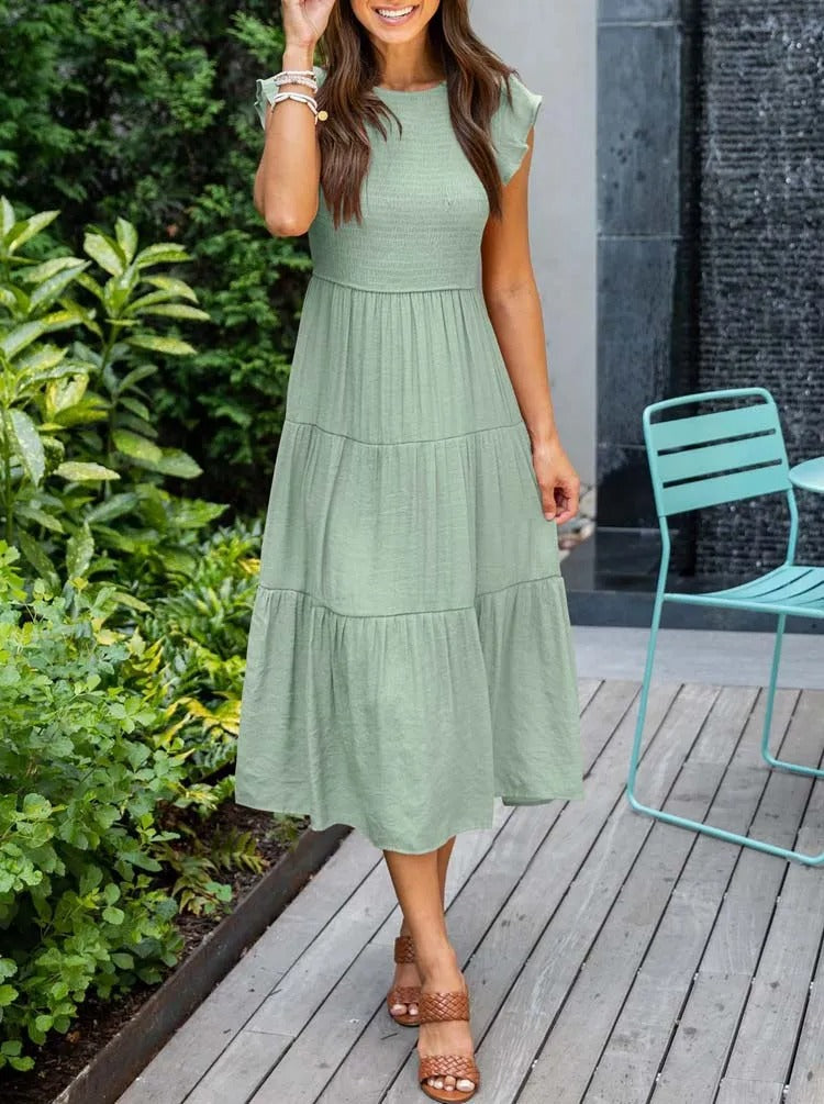 Luchtig ontwerp met ruches en praktische zakken Elegante zomerjurk - Seaton
