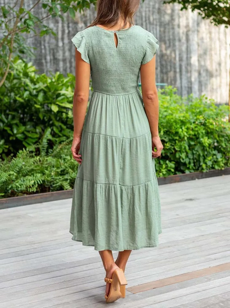 Luchtig ontwerp met ruches en praktische zakken Elegante zomerjurk - Seaton