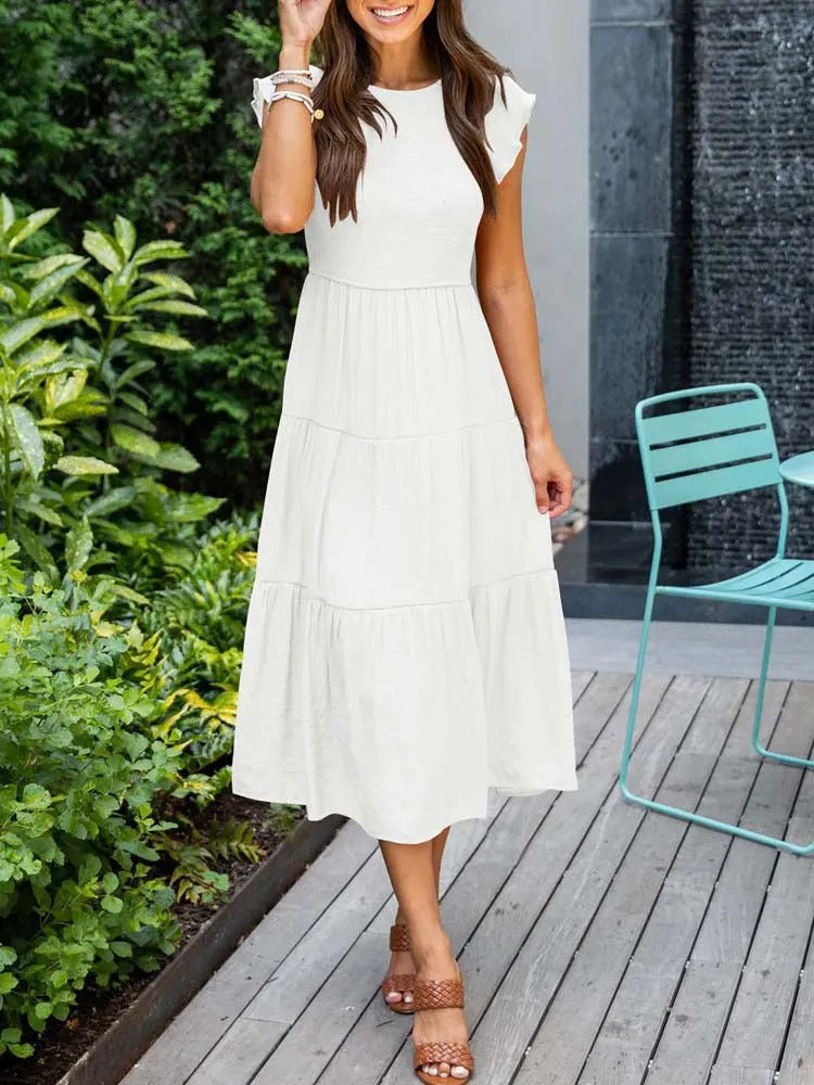 Luchtig ontwerp met ruches en praktische zakken Elegante zomerjurk - Seaton